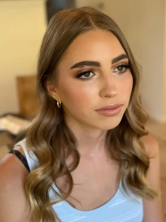 Soft bronze bridal glam with loose waves