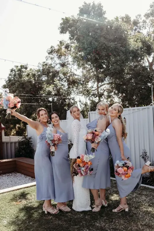 Bridesmaids in dusty-blue dresses