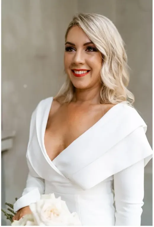 Bold red-lip glam with a modern white wrap dress