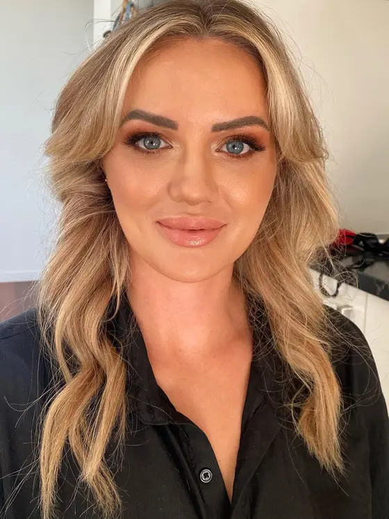 Warm smoky-eye glam with soft waves