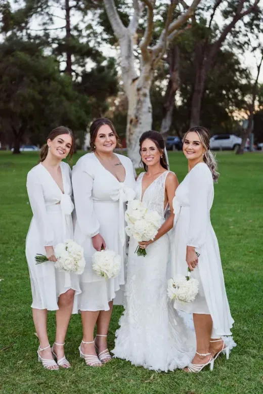 Bride with bridesmaids in cream and white